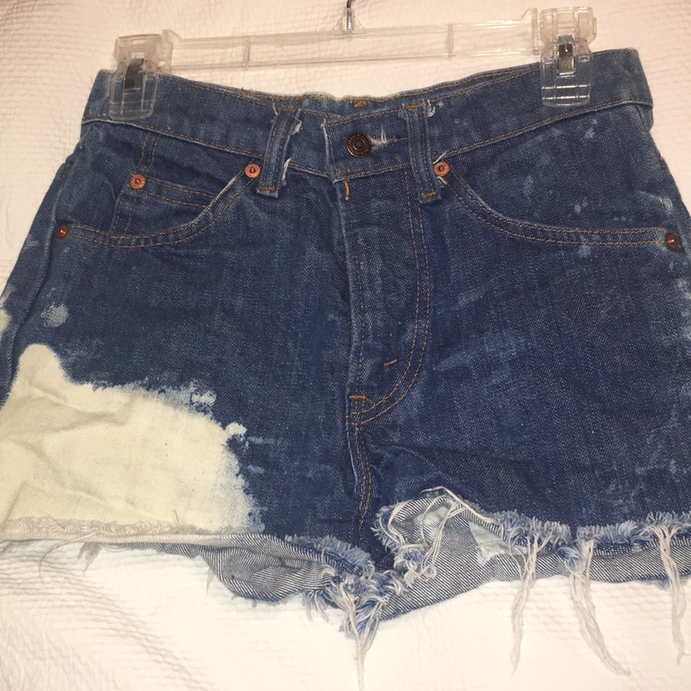 Distressed denim cutoffs